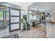 Open dining room with modern sliding door, stylish pendant lights, and wood table at 118 Elery Ter, Summerville, SC 29485