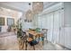 Bright dining room with modern table setting, neutral decor, and large windows at 118 Elery Ter, Summerville, SC 29485