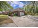 Brick home featuring an attached two-car garage and mature landscaping at 118 Elery Ter, Summerville, SC 29485