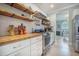 Well-lit kitchen with white cabinetry, stainless steel range, and modern appliances at 118 Elery Ter, Summerville, SC 29485