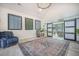 Bright living room featuring high ceilings, barn doors, and a comfortable seating area at 118 Elery Ter, Summerville, SC 29485