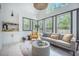 Comfortable living room with stylish decor, large windows, and a cozy atmosphere at 118 Elery Ter, Summerville, SC 29485