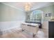 Bright office with arched window, modern desk, and serene color palette at 118 Elery Ter, Summerville, SC 29485