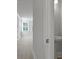 Bright white bathroom featuring a pedestal sink with modern fixtures and an open doorway at 118 Lilac Grove Way, Summerville, SC 29486