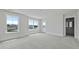 Spacious bedroom featuring carpet, two windows, door to the outside and an ensuite bathroom at 118 Lilac Grove Way, Summerville, SC 29486