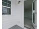 Inviting entryway with white siding, a window, and doorway view of the carpeted interior at 118 Lilac Grove Way, Summerville, SC 29486