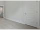 Hallway featuring paneled doors and trim with neutral carpet leading to additional rooms at 118 Lilac Grove Way, Summerville, SC 29486