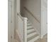 Bright staircase featuring white railings and light wood treads, offering a fresh and modern design aesthetic at 118 Lilac Grove Way, Summerville, SC 29486