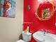 Colorful half bath with owl decor, decorative mirror, and white fixtures adding a unique charm at 1188 Quick Rabbit Loop, Charleston, SC 29414