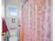 Cozy bathroom featuring a toilet and a shower with a patterned curtain at 1188 Quick Rabbit Loop, Charleston, SC 29414