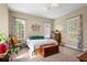 Bright and airy bedroom with multiple windows and inviting furnishings at 1188 Quick Rabbit Loop, Charleston, SC 29414