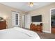 Cozy bedroom with a large window, a ceiling fan, and carpeted floors at 1188 Quick Rabbit Loop, Charleston, SC 29414