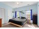 Cozy bedroom with light blue walls, two windows, and a neutral-toned carpet at 1188 Quick Rabbit Loop, Charleston, SC 29414