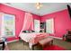 This bright pink bedroom features a cozy bed with a pink canopy at 1188 Quick Rabbit Loop, Charleston, SC 29414