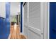 Hallway with wood floors leading into a open concept living and kitchen area at 1188 Quick Rabbit Loop, Charleston, SC 29414
