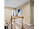 Well-lit hallway with wood trim and a view of the staircase and lower level at 1188 Quick Rabbit Loop, Charleston, SC 29414