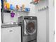 This laundry room features a Maytag washer and dryer with overhead storage at 1188 Quick Rabbit Loop, Charleston, SC 29414