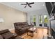 Comfortable living room with a ceiling fan, fireplace and beautiful hardwood floors at 1188 Quick Rabbit Loop, Charleston, SC 29414