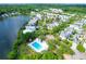 An aerial view of a pool surrounded by trees and homes at 1243 Appling Dr, Mount Pleasant, SC 29464