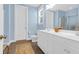 Bathroom featuring double vanity with bright blue walls, tiled floors, and white trim at 1243 Appling Dr, Mount Pleasant, SC 29464