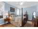 Cozy bedroom with four-poster bed, bright windows, and neutral decor at 1243 Appling Dr, Mount Pleasant, SC 29464