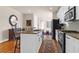 Eat-in kitchen has stainless appliances, stone countertops, and white cabinets at 1243 Appling Dr, Mount Pleasant, SC 29464