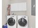 Laundry room with modern washer and dryer, and ample white cabinet storage at 1243 Appling Dr, Mount Pleasant, SC 29464