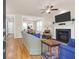 Bright living room features a fireplace, ceiling fan, and hardwood flooring at 1243 Appling Dr, Mount Pleasant, SC 29464