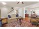 Cozy living room with area rug, ceiling fan, and staircase access at 1243 Appling Dr, Mount Pleasant, SC 29464