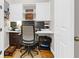 Home office featuring a built-in desk, overhead cabinets, and comfortable seating at 1243 Appling Dr, Mount Pleasant, SC 29464