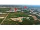 An aerial view of Nexton Square with newly constructed homes surrounded by green trees and serene lakes at 131 Lilac Grove Way, Summerville, SC 29486