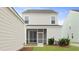 View of the backyard with a screened-in porch and easy access to the detached garage at 131 Lilac Grove Way, Summerville, SC 29486