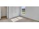 Comfortable bedroom with neutral carpet, featuring a closet and a window for natural light at 131 Lilac Grove Way, Summerville, SC 29486