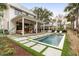 Backyard featuring a pool, patio with seating, and an outdoor kitchen with bar at 1412 Jackson St, Mount Pleasant, SC 29464
