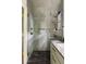 Luxurious shower featuring rainfall head, handheld sprayer, and integrated shampoo niche at 1412 Jackson St, Mount Pleasant, SC 29464