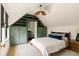 Angled bedroom features custom green built-ins, white bedding, and wood ceiling fan at 1412 Jackson St, Mount Pleasant, SC 29464