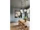 Bright dining area featuring built-in cabinets, a modern light fixture, and stylish decor accents at 1412 Jackson St, Mount Pleasant, SC 29464