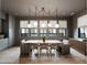 Elegant dining room featuring hardwood floors, large windows, and modern globe pendant lighting fixtures at 1412 Jackson St, Mount Pleasant, SC 29464