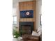 Elegant fireplace and wooden accent wall in a modernly designed living room at 1412 Jackson St, Mount Pleasant, SC 29464