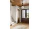 Welcoming foyer with hardwood floors, staircase, wood ceiling, and elegant double doors with sidelights at 1412 Jackson St, Mount Pleasant, SC 29464