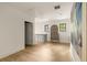 Bright hallway with hardwood floors, two windows and vintage cabinet between rooms at 1412 Jackson St, Mount Pleasant, SC 29464