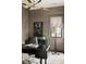 This home office features contemporary lighting, a large desk, and neutral wallpaper at 1412 Jackson St, Mount Pleasant, SC 29464