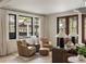 Inviting living area featuring hardwood floors, a cozy seating area, and abundant natural light at 1412 Jackson St, Mount Pleasant, SC 29464