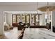 Bright living room with french doors, wood floors, and comfortable seating arrangement at 1412 Jackson St, Mount Pleasant, SC 29464