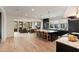 The open floor plan features hardwood flooring, lots of natural light, kitchen island and adjacent Gathering room at 1412 Jackson St, Mount Pleasant, SC 29464