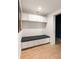 This mud room has built-in storage cabinets and bench with hardwood floors at 1412 Jackson St, Mount Pleasant, SC 29464