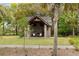 Outdoor pool house featuring brick grill with seating area and manicured lawn at 1412 Jackson St, Mount Pleasant, SC 29464