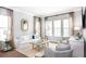 Comfortable living room featuring neutral tones, plush seating, and large windows for plenty of natural light at 1431 Clay Field Trl, Summerville, SC 29485
