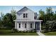Charming two-story home with a welcoming front porch and beautifully landscaped yard at 1433 Clay Field Trl, Summerville, SC 29485