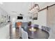 Dining room showcasing a sliding barn door to the right of the table and modern light fixture above at 144 Jupiter Ln, Summerville, SC 29483
